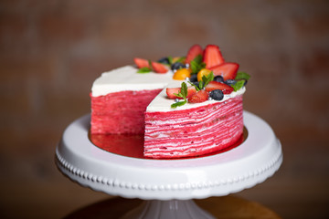 Delicious raspberry cake with fresh strawberries