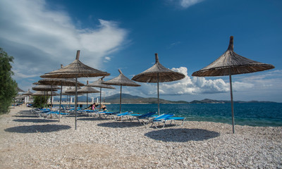 beautiful view of the beach with ambrelas