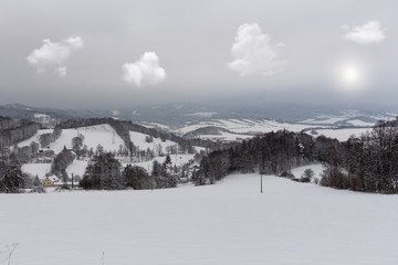 Majestic sunset in the winter mountains landscape. Dramatic sky.