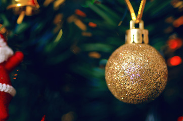 Christmas toy decoration on the tree glitter macro blur background