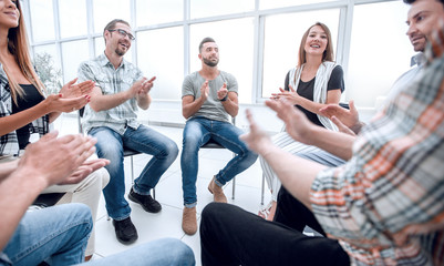 business team applauds at a workshop