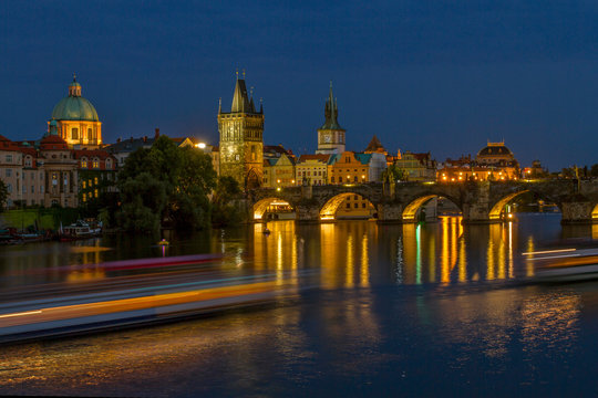 Charles bridge in Prague in evening .Night view of the River Vltava and Charles Bridge . The historical center of Prague. The Czech Republic.