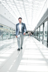 businessman walking in the airport building