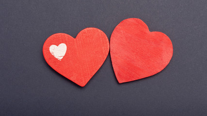 red heart on a dark paper background. The concept of Valentine's Day, the day of love, mother's day. Copy space background texture