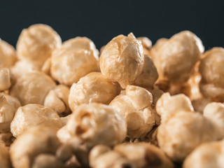 Close up view of caramel corn on black background