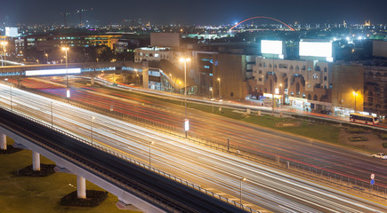 Fototapeta na wymiar night scene of street in Dubai city, UAE.
