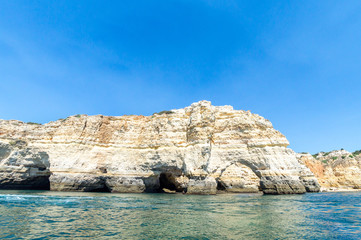 Fototapeta na wymiar Limestone formations on the coastline and beach of Algarve, Benagil, Portugal