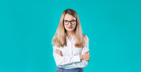 Blank for advertising. Portrait young caucasian woman worker teacher coach mentor in white shirt office style business lady leader advertising glasses eyesight blue isolated color background