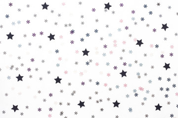 Christmas stars and snowflakes on white background, flat lay, top view