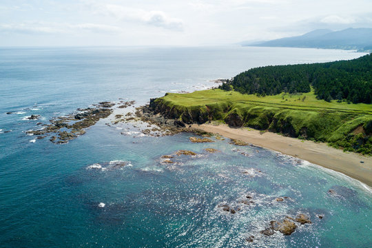 Aerial drone photo of cape Velikan (near by cape Ptichiy), Sakhalin island, Russia (Sahalin). Unbelievable natural green lawns