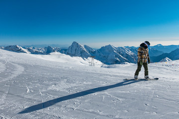 Fototapeta na wymiar Snowboarder on a slope