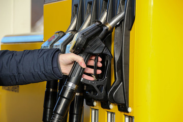gas pump nozzle at a gas station