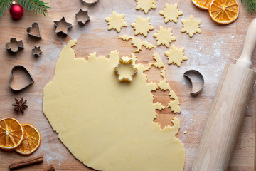 Cutting out star shapes for traditional Linzer Christmas cookies