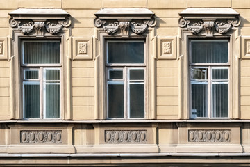Three Windows with bas-relief.