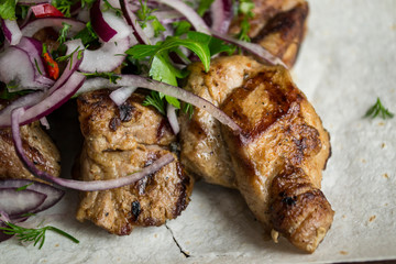 Grilled meat with sauce and spices.