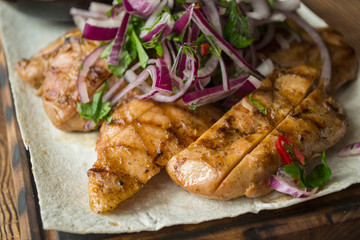 Grilled meat with sauce and spices.