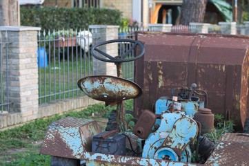 Old farm tractor in the garden (Pesaro, Italy)