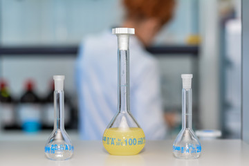 scientist in laboratory with test tubes