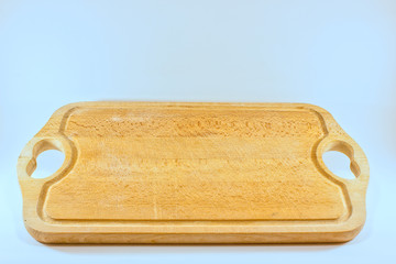 used wooden cutting board isolated on a white background