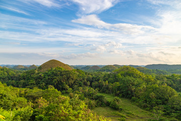 Chocolate Hills, blue sky with clouds. Unique place in Bohol, Philippines.