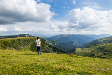 Fototapeta na wymiar Woman looking at mountain landscape