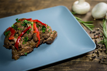 Fried livers with vegetables