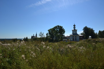 Fototapeta na wymiar old modest church on the banks of the river colva