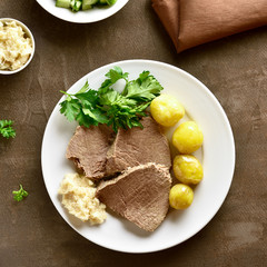 Boiled beef with potatoes and horseradish