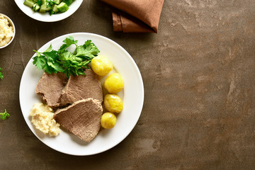 Boiled beef with potatoes and horseradish
