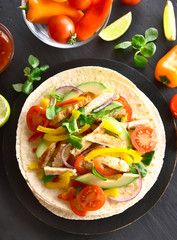 Taco with chicken meat and vegetables
