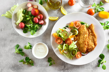 Vegetable salad and schnitzel