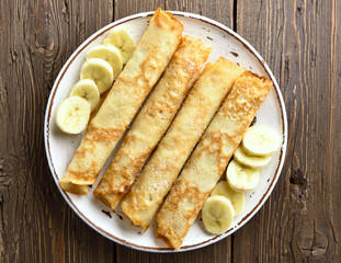 Crepes roll with banana slices