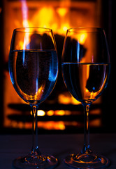 Wine glasses by the fireplace