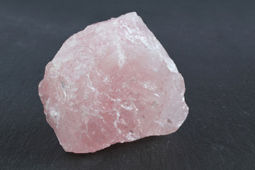 Pink quartz on a black stone board