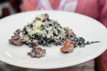 a plate with pasta with parmesan and seafood