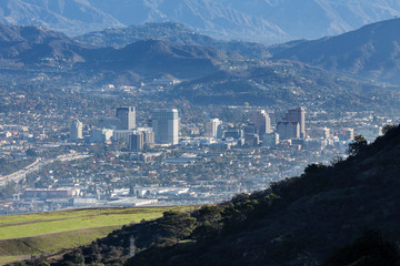 Downtown Glendale with the San Gabriel Mountains in background.  View from hilltop at popular...