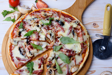 Tasty and flavorful pizza on the table. Appetizing homemade pizza.