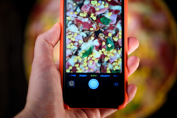 Tasty and flavorful pizza on the table. Appetizing homemade pizza.