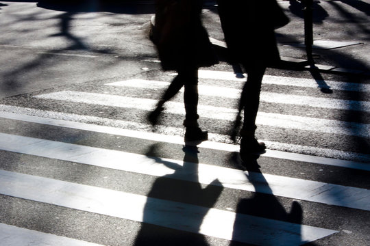 Blurry zebra crossing with pedestrians