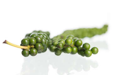 Fresh black pepper on white background