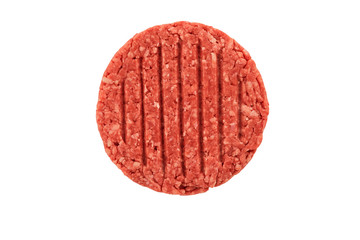 Close up on a raw ground beef burger steak patty isolated on white background. Directly above.