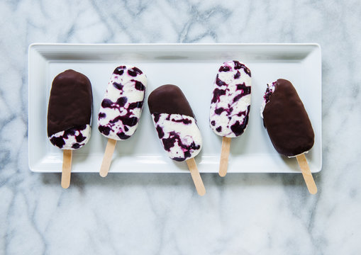 Popsicles on white plate