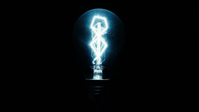 Beautiful unusual cold light bulb on a dark background