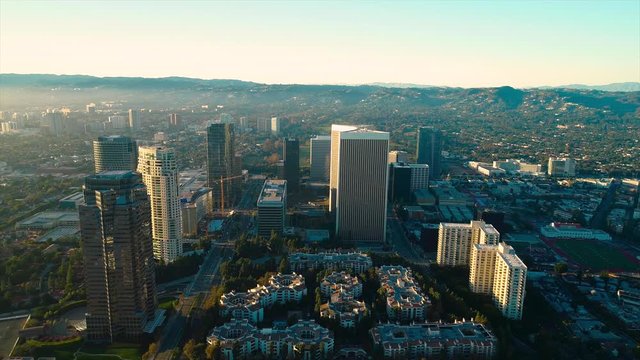 Studio City Los Angeles CA December 2018 sunset 5PM near skyline aerial view with Beverly Hills and the Santa Monica Mountains in background from helicopter drone plane