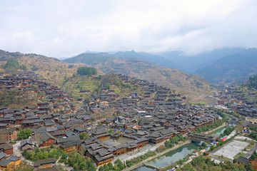Qian Hu Miao Zai Ancient Village in morning mist , Guizhou province China.