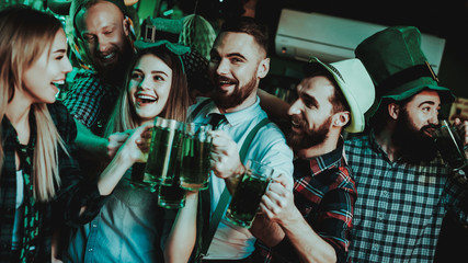 Young Company With Beer Glasses. St Patrick's Day.