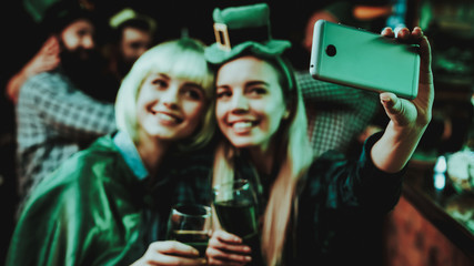 Two Girls Do Selfie In Pub. St Patrick's Day.