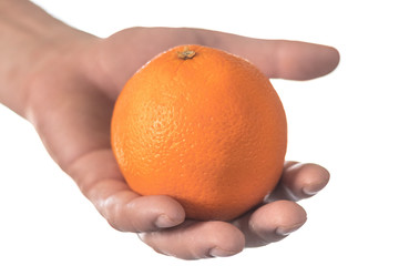 Juicy ripe orange in hand; a healthy fruit option to eat.