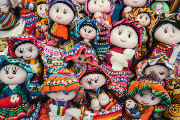 Fototapeta na wymiar Dolls in Peru market, colorful traditional peruvian dolls