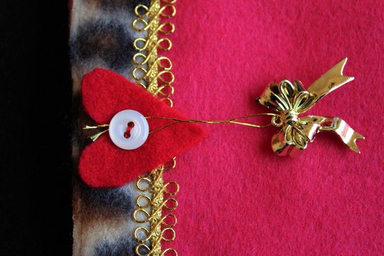Details of handmade pink felt Christmas stocking